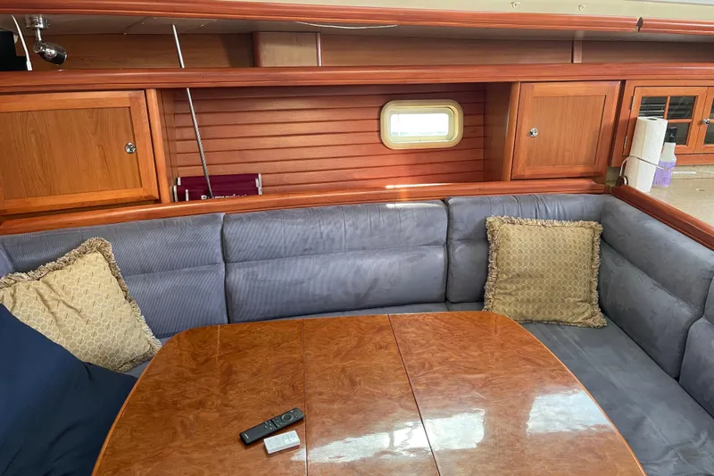  Yacht Photos Pics Luxurious interior of 2008 Hunter 49 yacht with plush seating and wooden accents.