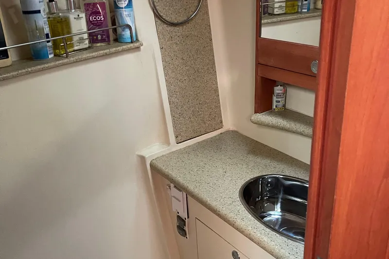  Yacht Photos Pics Bathroom interior of 2008 Hunter 49 yacht with sink and toiletries.