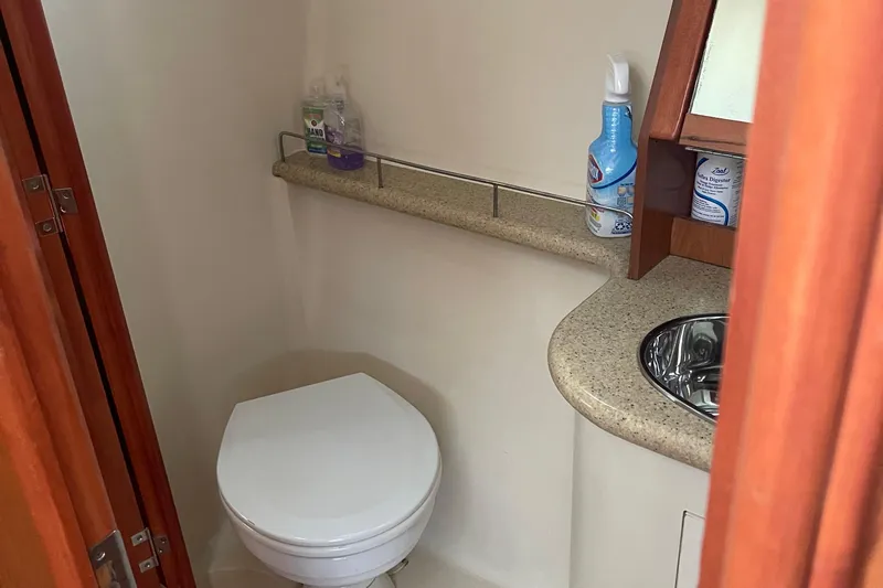  Yacht Photos Pics Compact bathroom in a 2008 Hunter 49 yacht, featuring a toilet and sink.