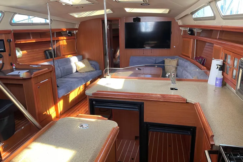  Yacht Photos Pics Luxurious interior of 2008 Hunter 49 yacht with spacious seating and modern amenities.