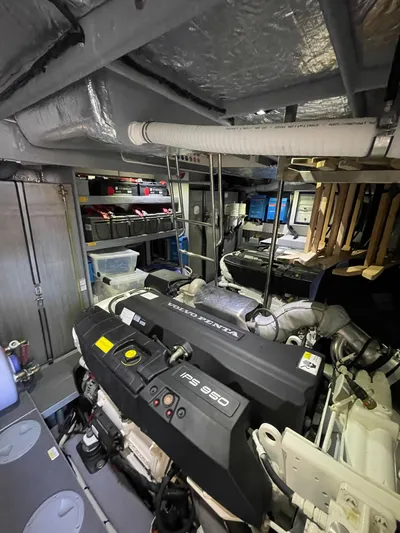  Yacht Photos Pics Engine room of a 2019 Absolute 62 Fly yacht, showcasing machinery and equipment.