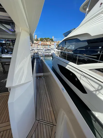  Yacht Photos Pics 2019 Absolute 62 Fly yacht docked at marina, showcasing sleek design and luxurious features.