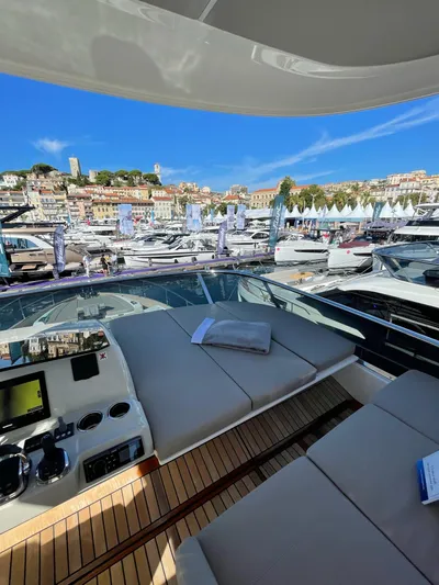  Yacht Photos Pics Luxurious 2019 Absolute 62 Fly yacht interior with marina view under clear blue sky.