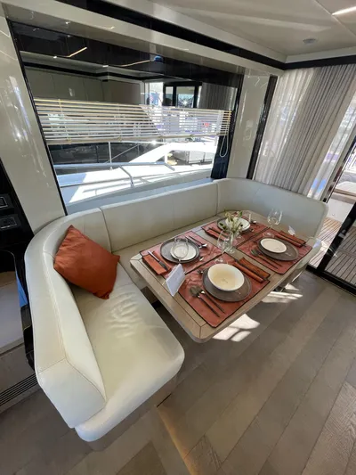  Yacht Photos Pics Luxurious dining area on a 2019 Absolute 62 Fly yacht with elegant table setting.