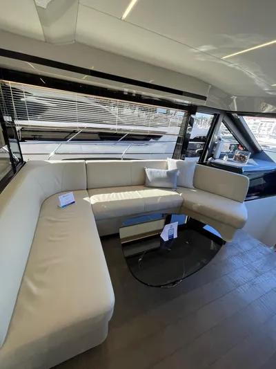  Yacht Photos Pics Luxurious interior of 2019 Absolute 62 Fly yacht with elegant seating and modern design.