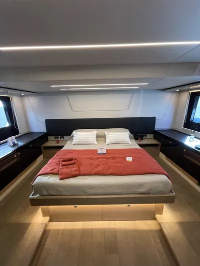  Yacht Photos Pics Luxurious bedroom interior of 2019 Absolute 62 Fly yacht with modern design and ambient lighting.