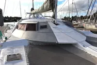 Custom 1996 CATAMARAN CUSTOM 60' docked, showcasing sleek design and spacious deck.