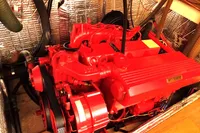 Red Beta Marine engine in a 1996 Custom CATAMARAN CUSTOM 60', surrounded by insulated walls.