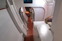 Interior of 1996 Custom CATAMARAN 60', featuring modern design and cozy sleeping area.