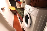 Interior of 1996 Custom Catamaran 60' with bunk bed and washing machine.