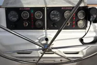 Steering wheel and control panel of 1996 Custom Catamaran 60', featuring Beta Marine gauges.