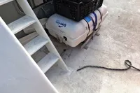 Deck of 1996 Custom Catamaran 60' with stairs, liferaft, and rope.