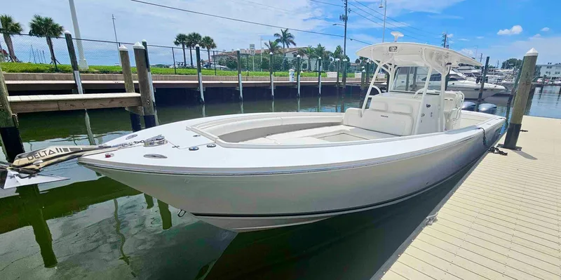Redemption Yacht Photos Pics 2012 Regulator 34SS boat docked at marina under clear blue sky.