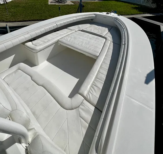 Redemption Yacht Photos Pics 2012 Regulator 34SS boat interior with white cushioned seating.