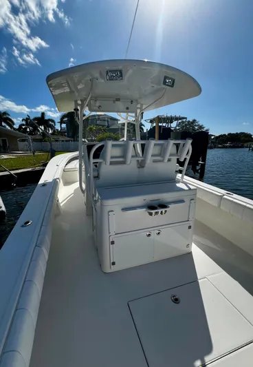 Redemption Yacht Photos Pics 2012 Regulator 34SS boat with seating, docked under sunny skies.
