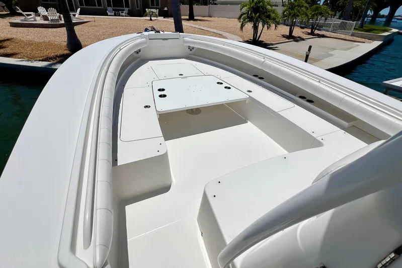 Redemption Yacht Photos Pics 2012 Regulator 34SS boat deck with spacious seating and storage compartments.