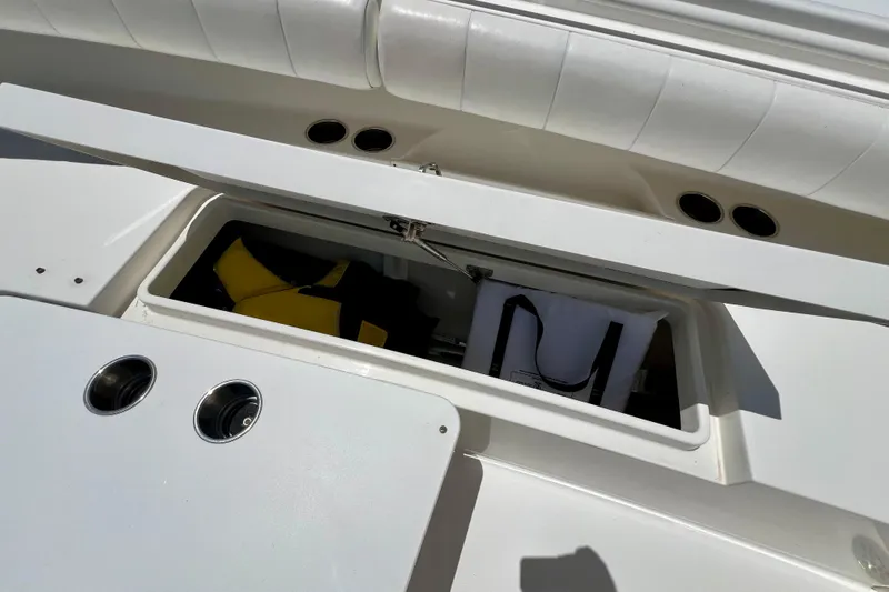 Redemption Yacht Photos Pics Open storage compartment on 2012 Regulator 34SS boat with life jackets inside.