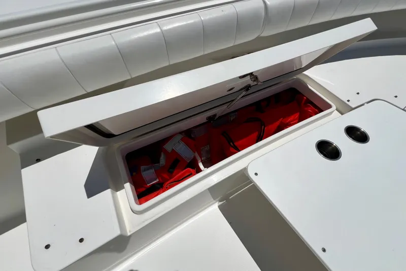 Redemption Yacht Photos Pics Open storage compartment on 2012 Regulator 34SS boat, revealing red life jackets.