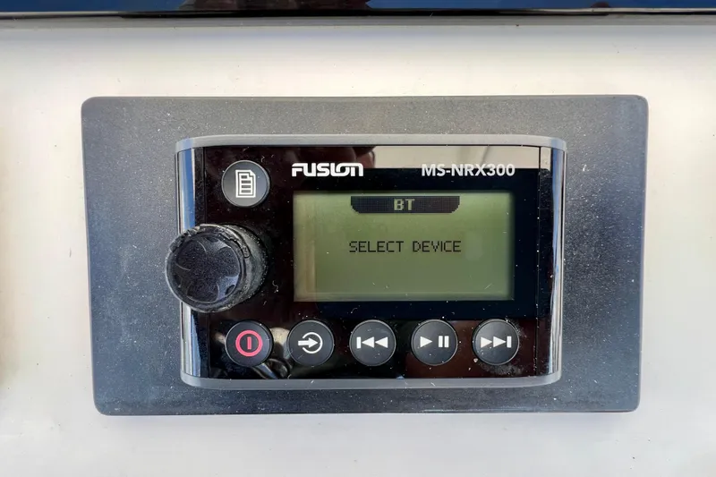 Redemption Yacht Photos Pics Fusion MS-NRX300 audio system on 2012 Regulator 34SS boat, displaying "Select Device."