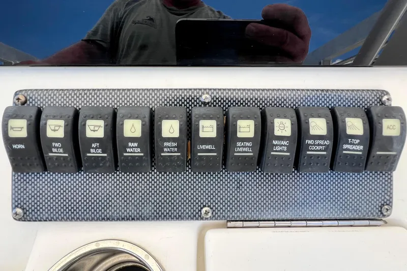 Redemption Yacht Photos Pics Control panel of a 2012 Regulator 34SS boat with labeled switches.