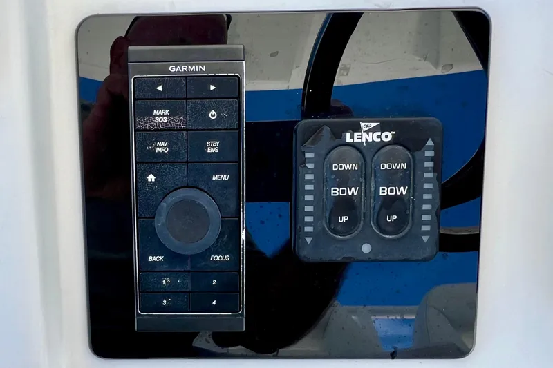 Redemption Yacht Photos Pics Control panel of a 2012 Regulator 34SS boat with Garmin and Lenco systems.