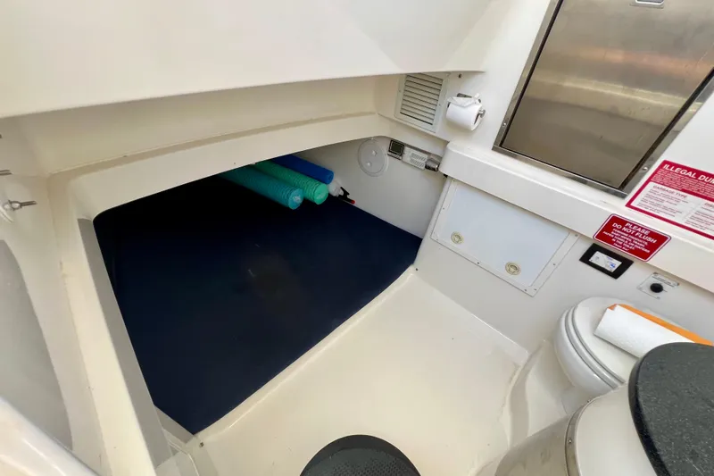 Redemption Yacht Photos Pics 2012 Regulator 34SS cabin interior with storage and toilet area.