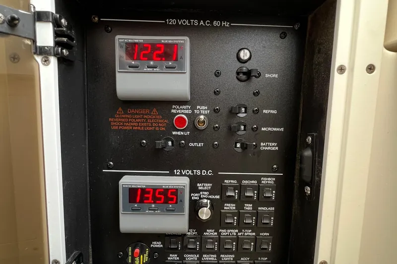 Redemption Yacht Photos Pics Electrical panel of 2012 Regulator 34SS boat showing voltage meters and switches.
