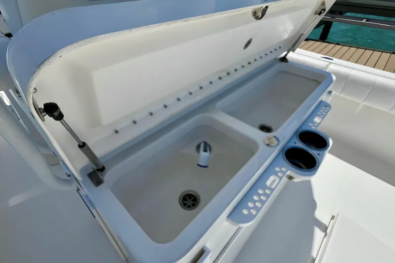 Redemption Yacht Photos Pics Open storage compartment on 2012 Regulator 34SS boat with cup holders.