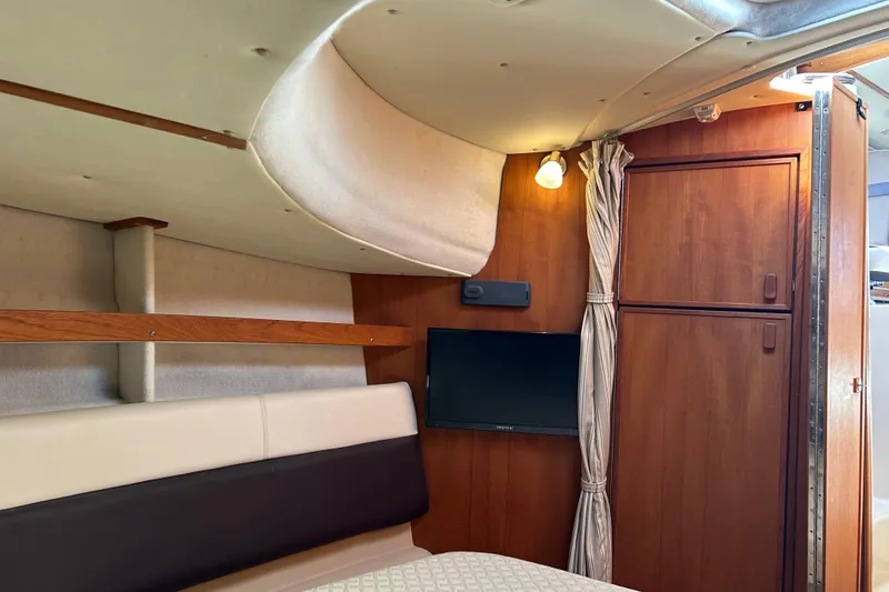  Yacht Photos Pics Interior of 2015 Ranger Tugs R-31 CB boat with wood paneling and TV.