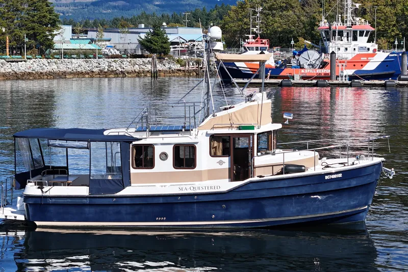  Yacht Photos Pics 2015 Ranger Tugs R-31 CB boat docked in a scenic marina setting.