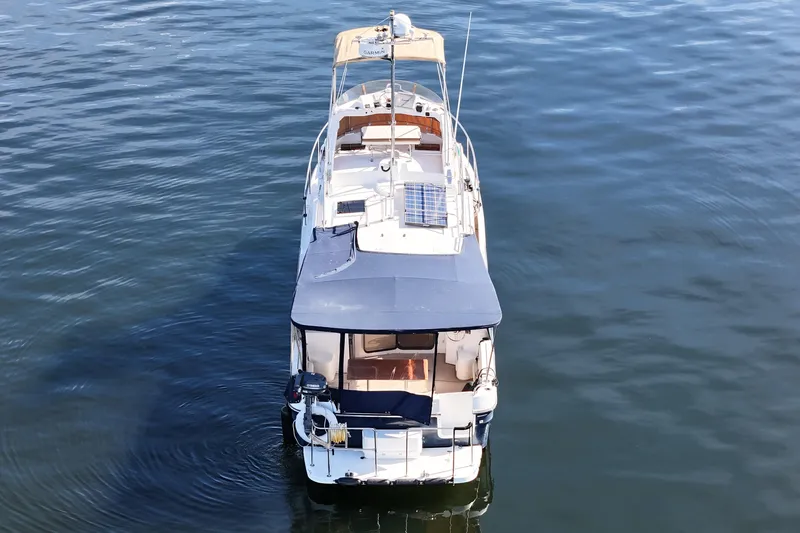  Yacht Photos Pics 2015 Ranger Tugs R-31 CB boat on calm water, aerial view.