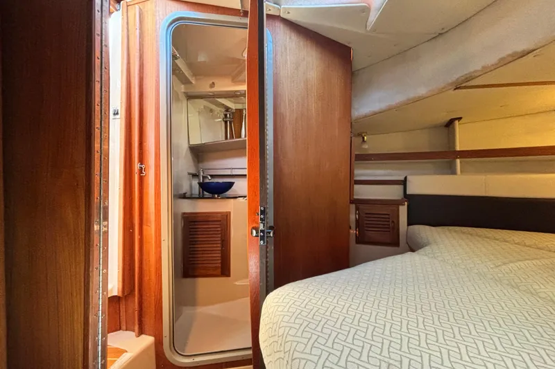  Yacht Photos Pics Interior of 2015 Ranger Tugs R-31 CB boat, featuring cozy cabin and bathroom.