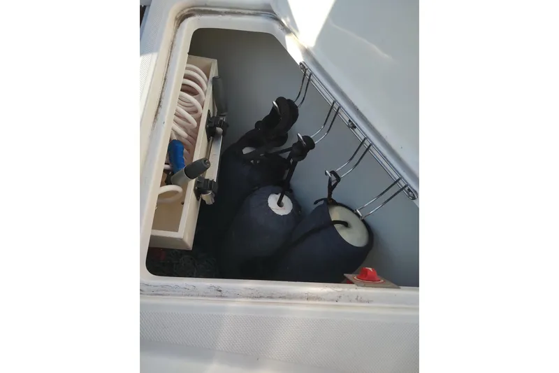 Me Yacht Photos Pics Storage compartment on a 2021 Regal 42 Fly boat with fenders and coiled ropes.