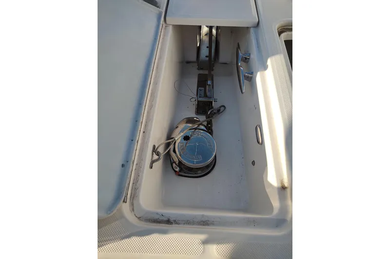 Me Yacht Photos Pics Anchor compartment of 2021 Regal 42 Fly yacht, featuring a winch and cleat.