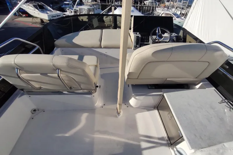 Me Yacht Photos Pics Flybridge of 2021 Regal 42 Fly yacht with helm and seating area.