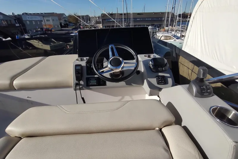 Me Yacht Photos Pics 2021 Regal 42 Fly yacht helm with modern controls and steering wheel.