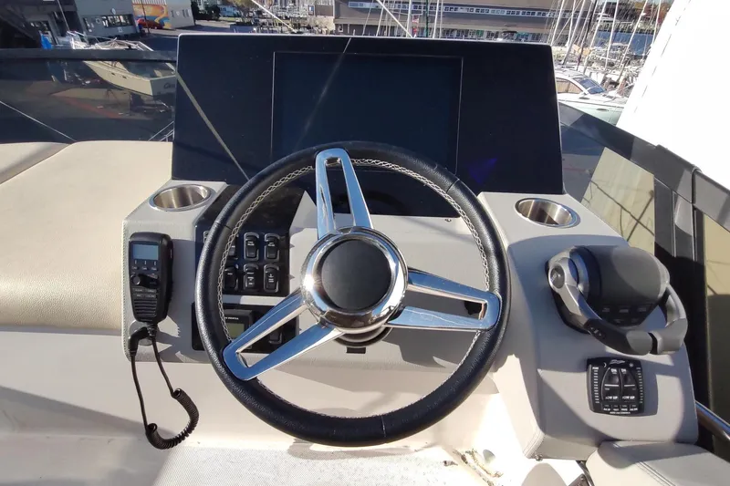 Me Yacht Photos Pics Helm of 2021 Regal 42 Fly yacht with steering wheel and controls.