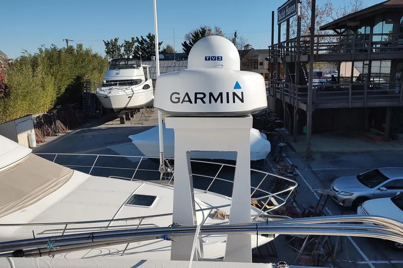 Me Yacht Photos Pics 2021 Regal 42 Fly yacht with Garmin radar at a marina.