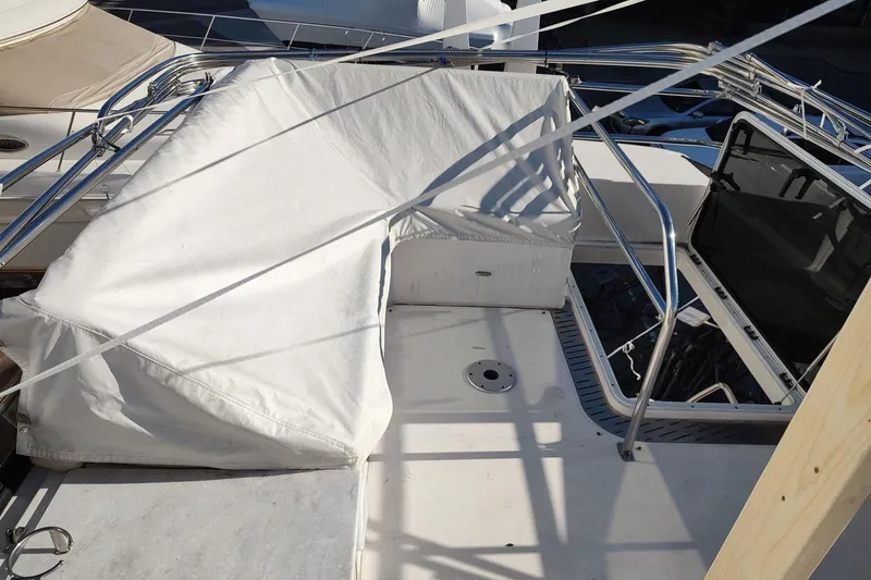 Me Yacht Photos Pics 2021 Regal 42 Fly yacht deck with covered seating and open hatch.