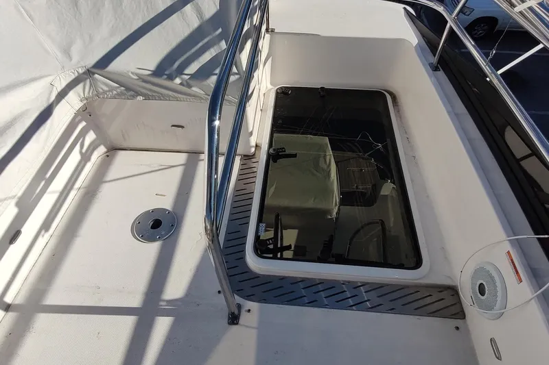 Me Yacht Photos Pics 2021 Regal 42 Fly yacht deck with railing and hatch, showcasing modern design.