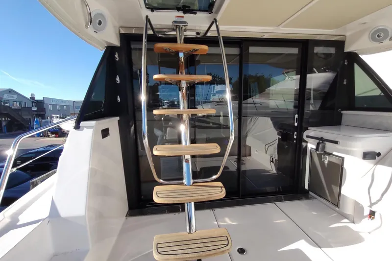 Me Yacht Photos Pics Staircase on 2021 Regal 42 Fly yacht, leading to upper deck with modern design.