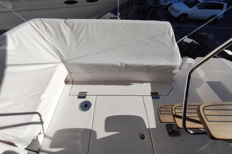 Me Yacht Photos Pics 2021 Regal 42 Fly yacht deck with covered seating and wooden steps.