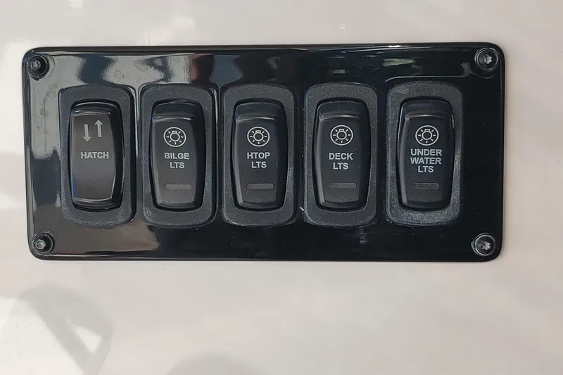 Me Yacht Photos Pics Control panel of a 2021 Regal 42 Fly boat with switches for hatch and lights.