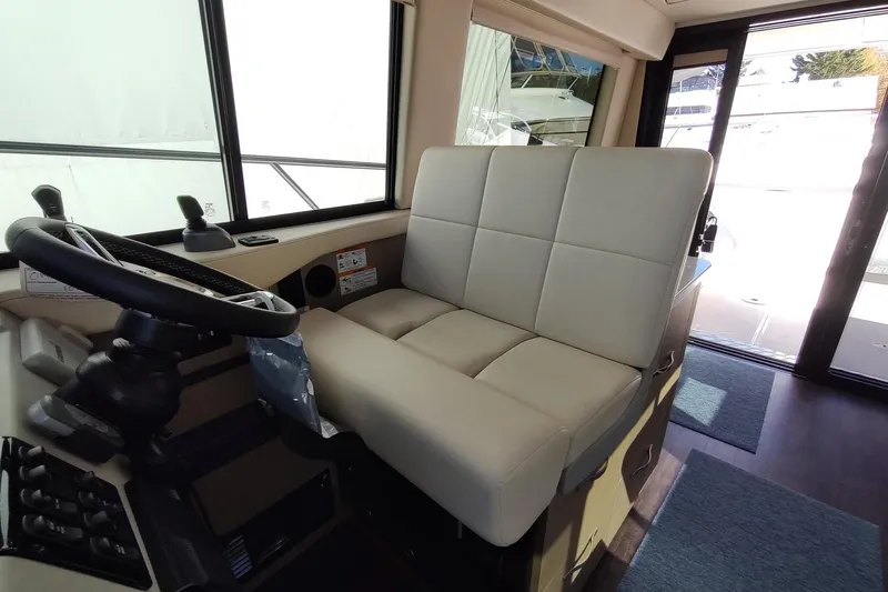 Me Yacht Photos Pics Interior helm of 2021 Regal 42 Fly yacht with modern steering and seating.