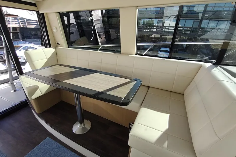 Me Yacht Photos Pics Luxurious interior of 2021 Regal 42 Fly yacht with elegant seating and table.