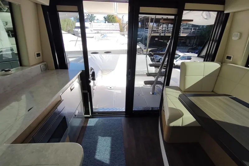 Me Yacht Photos Pics Interior view of 2021 Regal 42 Fly yacht, featuring modern seating and sleek design.