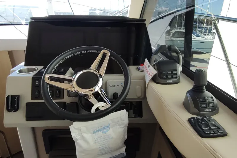 Me Yacht Photos Pics Helm of 2021 Regal 42 Fly yacht with Garmin navigation and Volvo Penta controls.