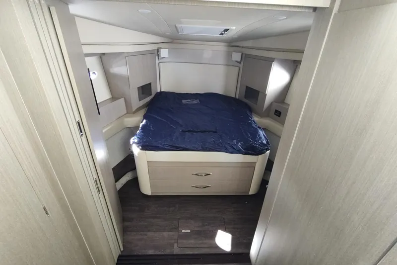Me Yacht Photos Pics Luxurious cabin interior of 2021 Regal 42 Fly yacht with cozy bed and modern design.