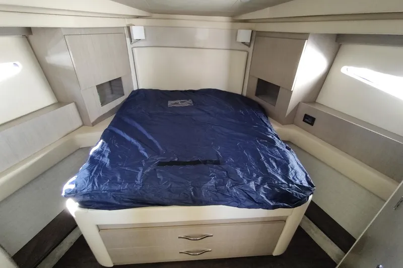Me Yacht Photos Pics Luxurious cabin interior of 2021 Regal 42 Fly yacht with a neatly made bed.