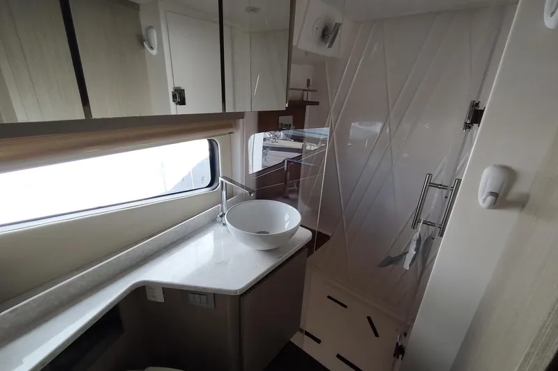 Me Yacht Photos Pics Modern bathroom interior of 2021 Regal 42 Fly yacht with sleek design.